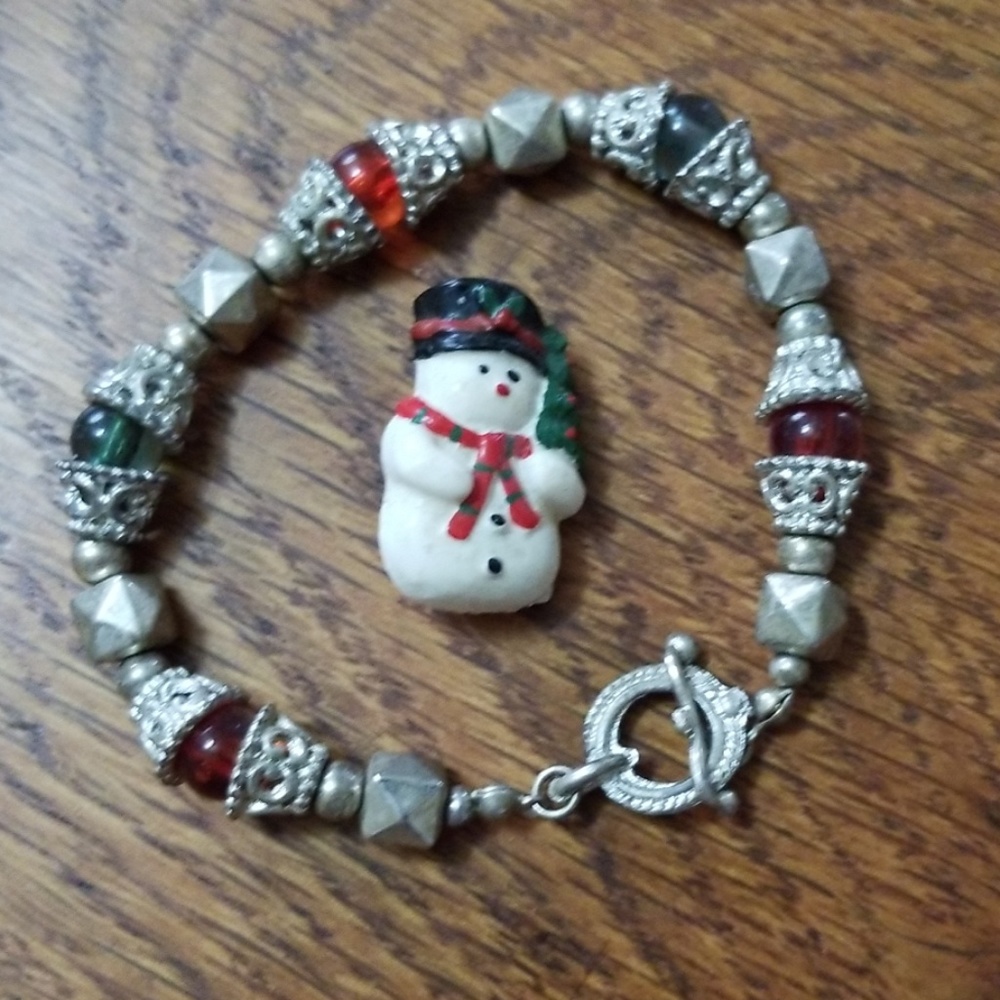 Snowman pin and red/green Christmas stretch bracel